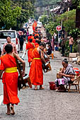 Luang Prabang, Laos - At dawn, monks receive their alms, the 'Tak bat'. 